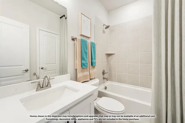 a living room with furniture a fireplace a rug and a large window