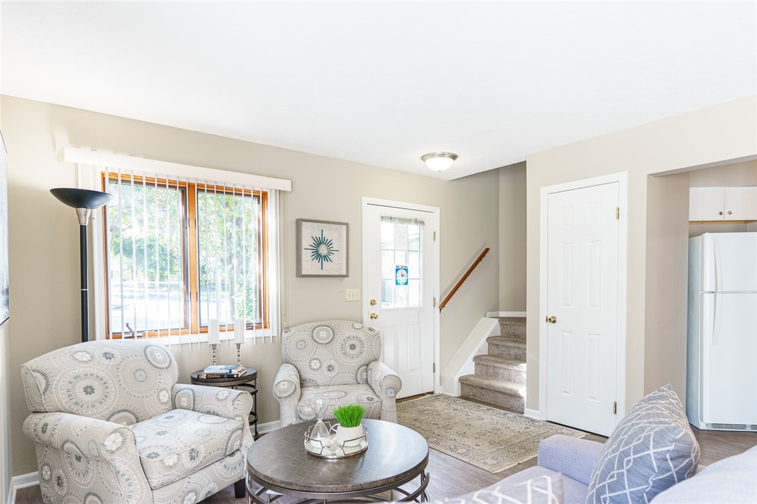 32 Riverferry Way Rochester, NY 14608 - Photo 4 of 10 Typical Great Room with faux wood floors (view sho