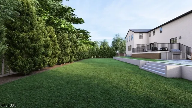 a front view of a house with a yard and green space