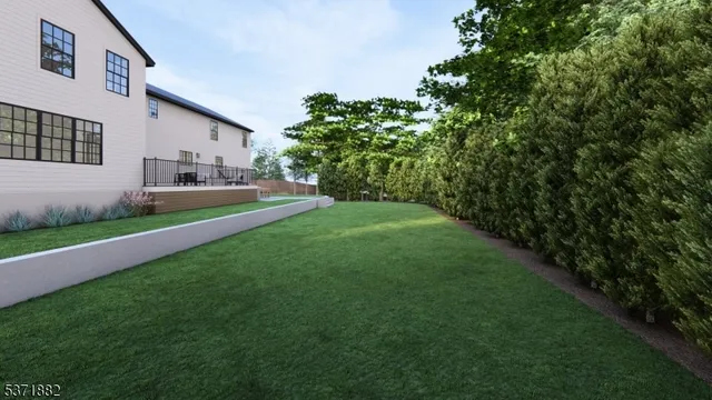 a front view of a house with a garden and yard
