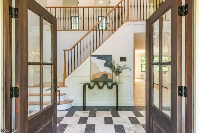 a view of staircase with wooden floor and a potted plant