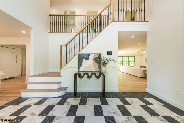 a view of entryway and hall with a rug