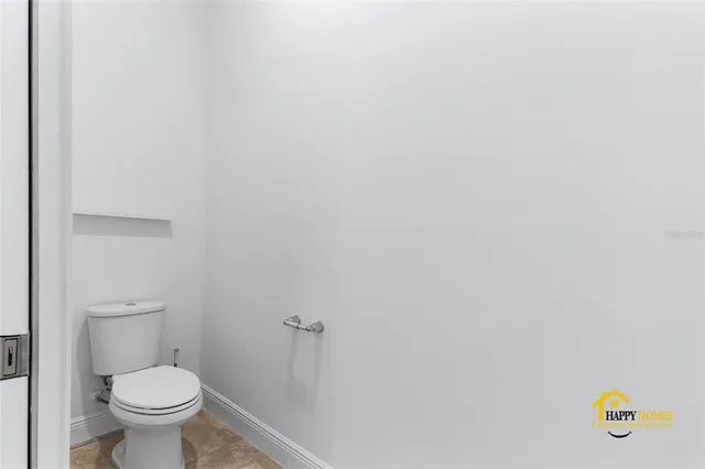 a bathroom with a toilet and a sink