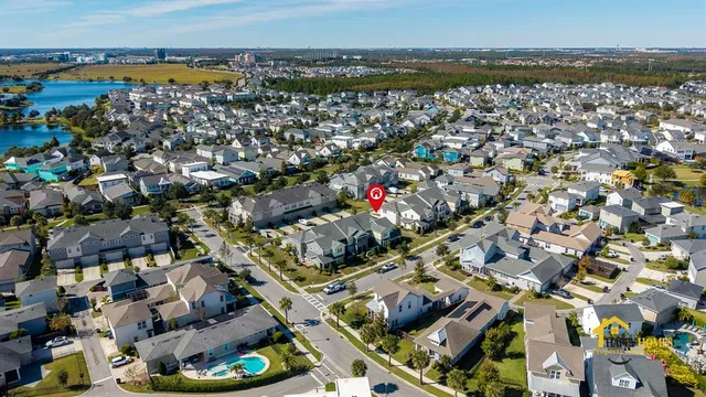 an aerial view of a residential houses with outdoor space