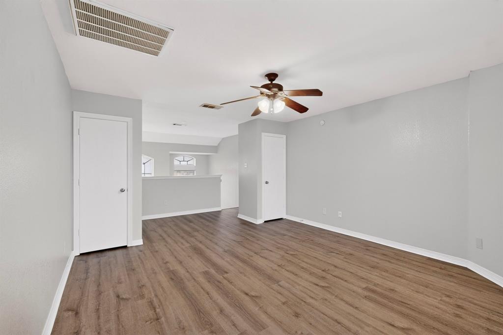 3401 Newgate Street Midlothian, TX 76065 - Photo 34 of 34 Spacious room with wood-finish flooring and light gray walls