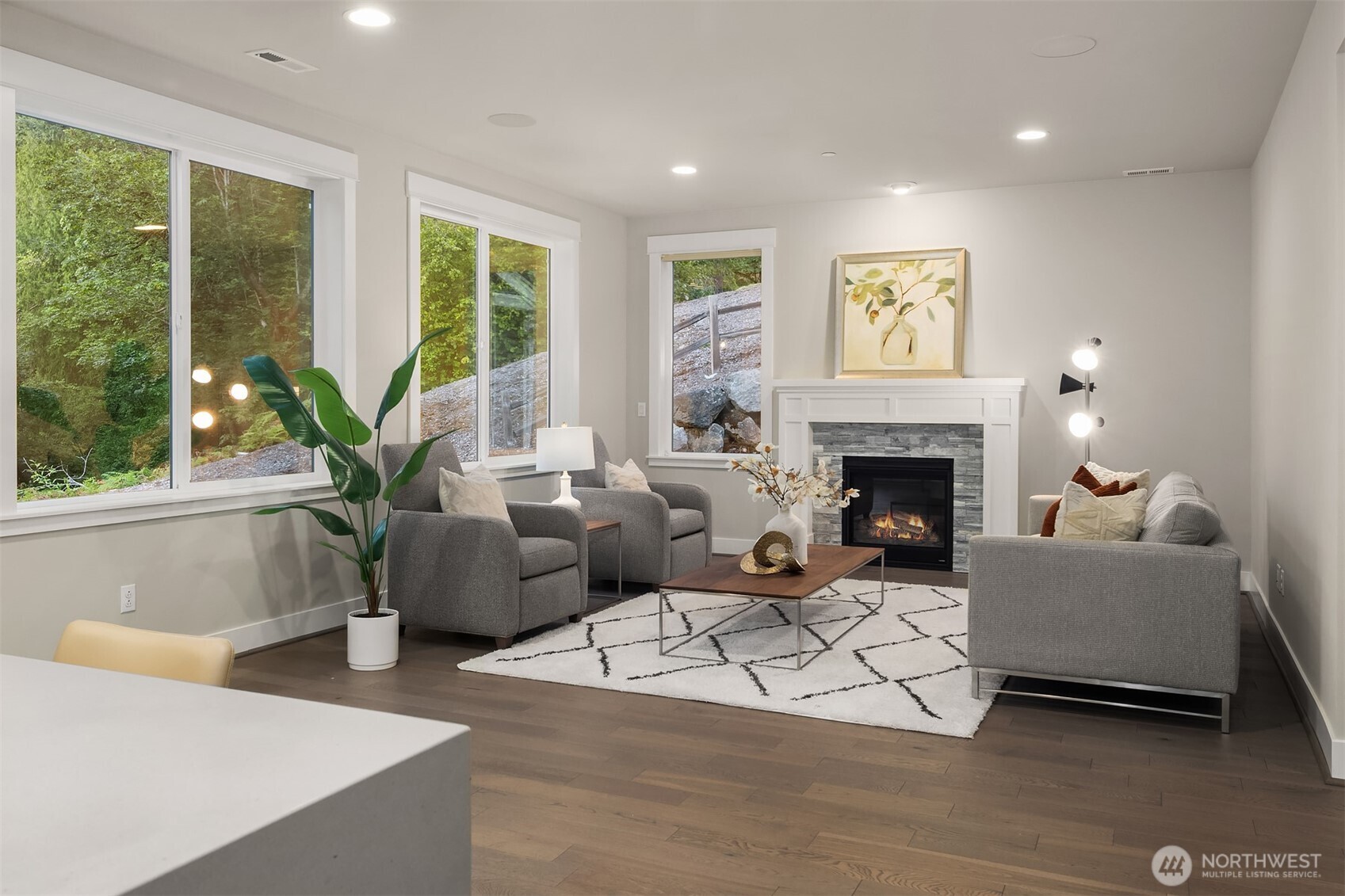 9934 Northeast 162nd Street Bothell, WA 98011 - Photo 11 of 40 a living room with furniture and a fireplace