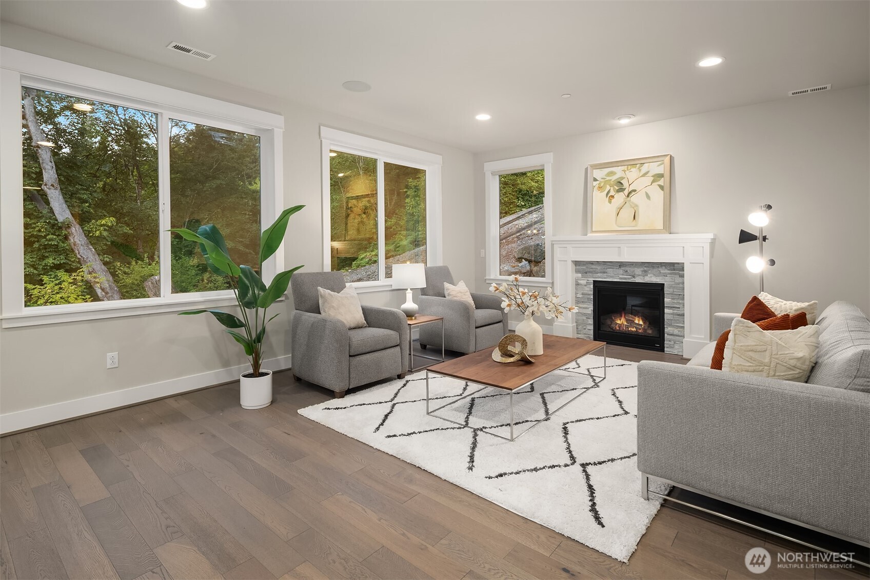 9934 Northeast 162nd Street Bothell, WA 98011 - Photo 13 of 40 a living room with furniture and a fireplace