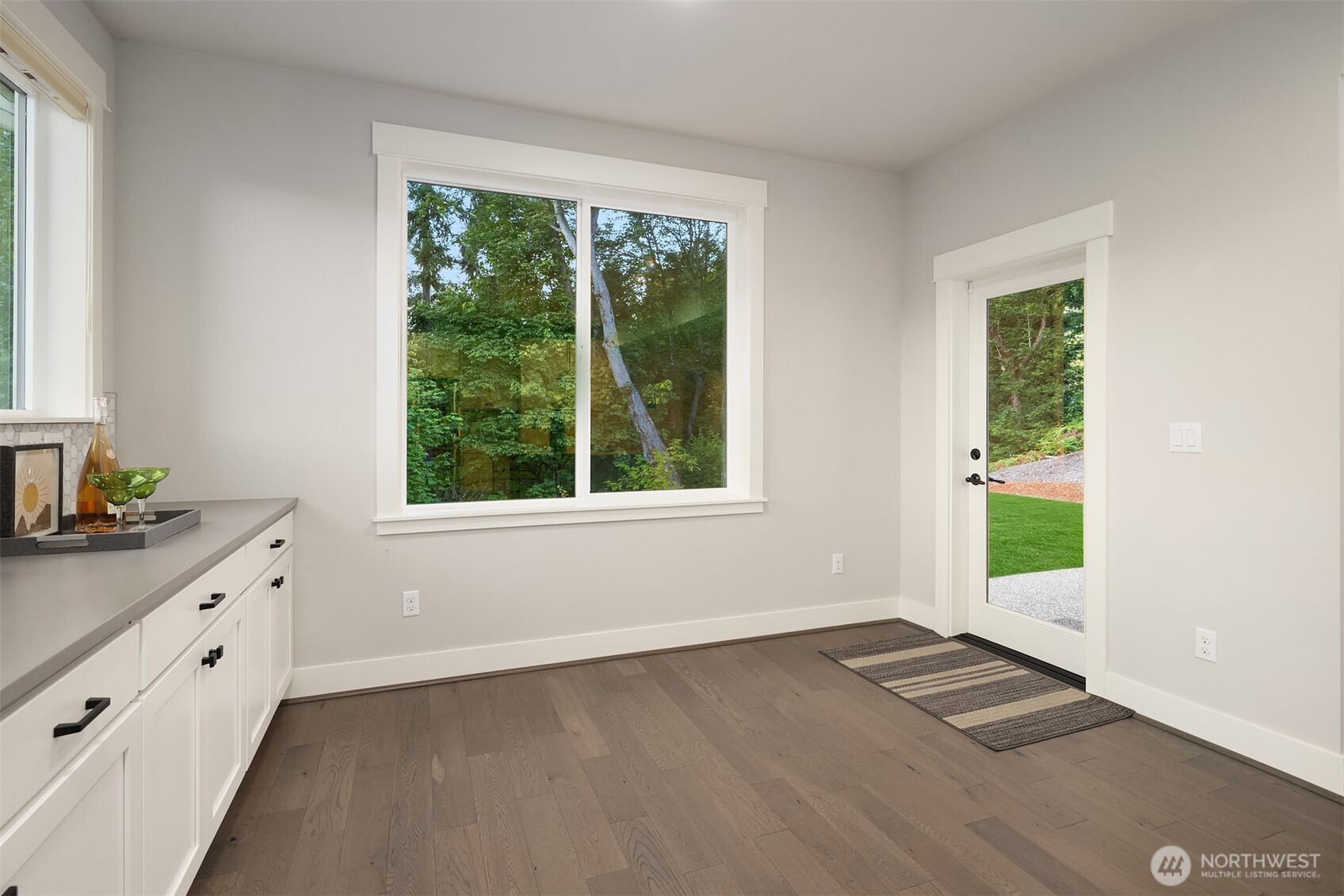 9934 Northeast 162nd Street Bothell, WA 98011 - Photo 15 of 40 wooden floor in an empty room with a window