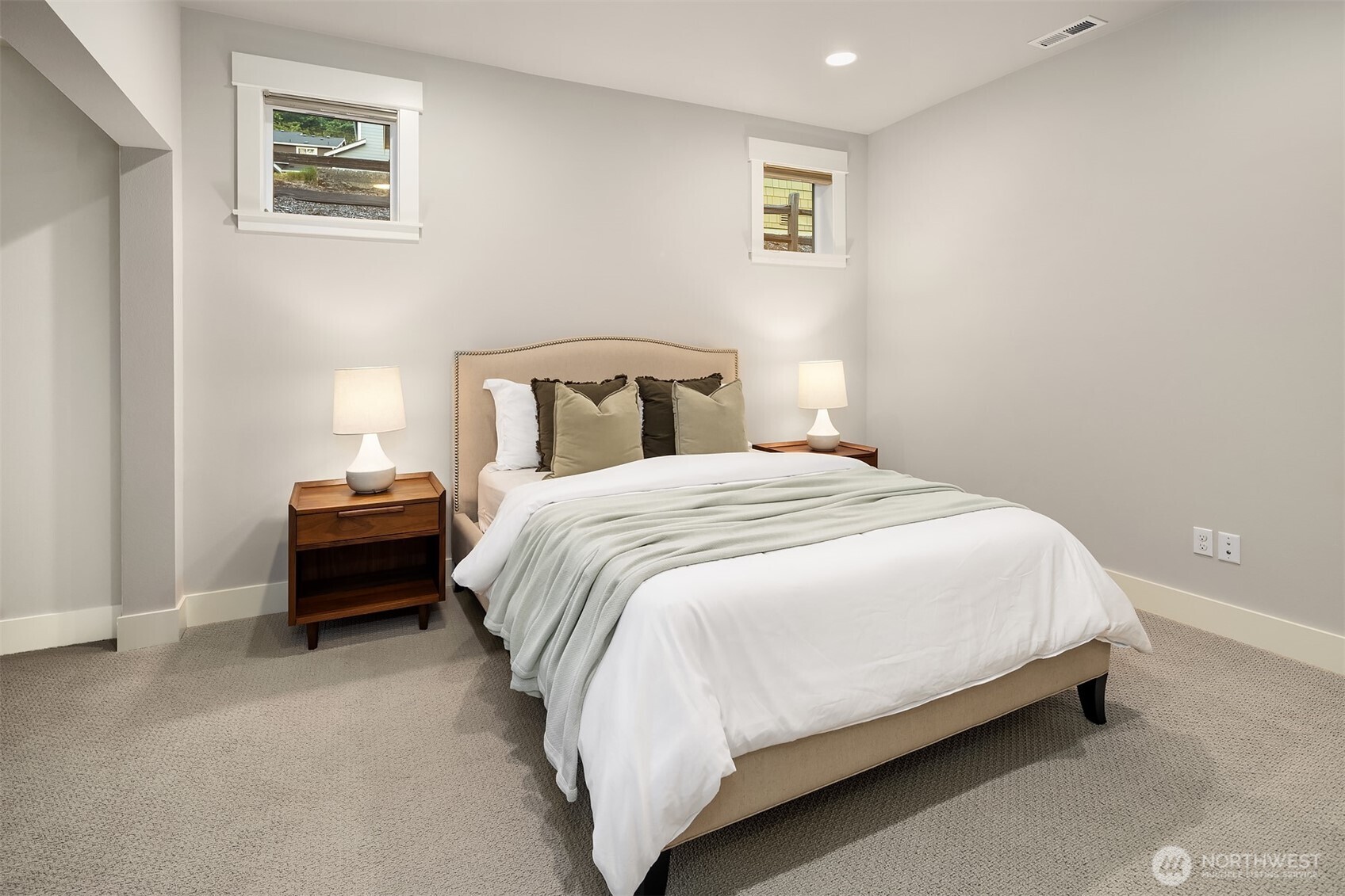 9934 Northeast 162nd Street Bothell, WA 98011 - Photo 16 of 40 a bed room with a bed and a night stand