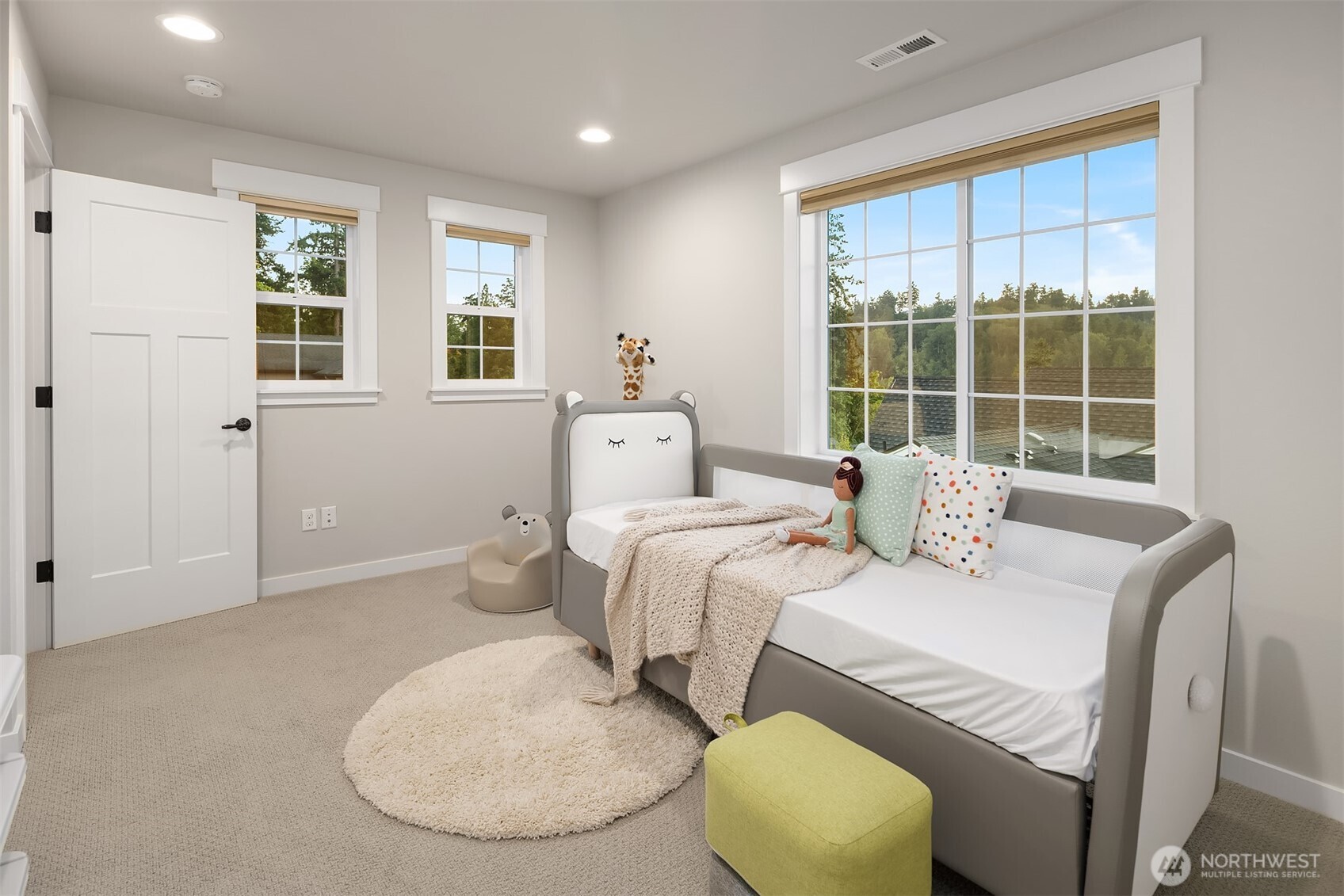 9934 Northeast 162nd Street Bothell, WA 98011 - Photo 22 of 40 a bedroom with a bed and window