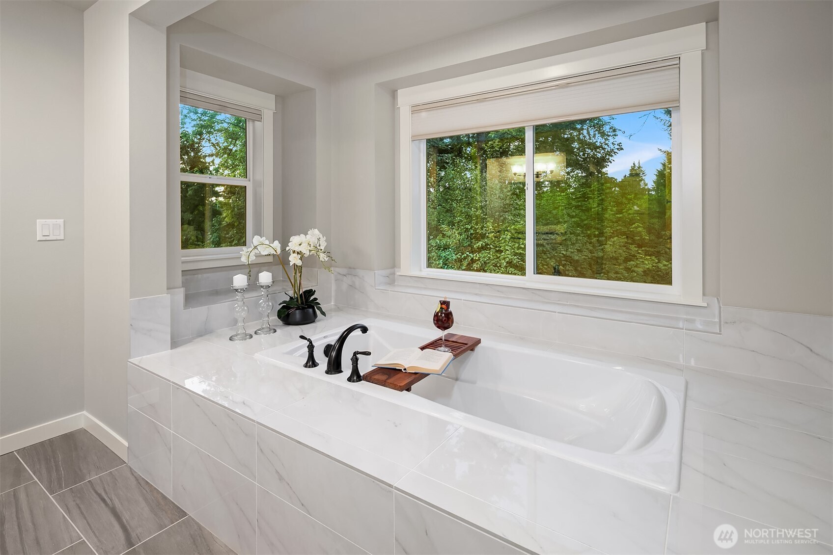 9934 Northeast 162nd Street Bothell, WA 98011 - Photo 26 of 40 a bathroom with a sink and a large window