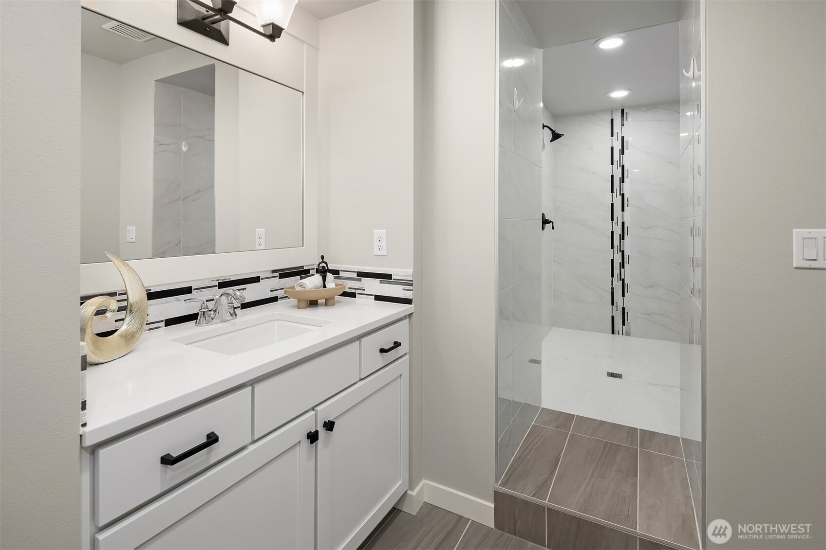 9934 Northeast 162nd Street Bothell, WA 98011 - Photo 27 of 40 a bathroom with a sink and mirror
