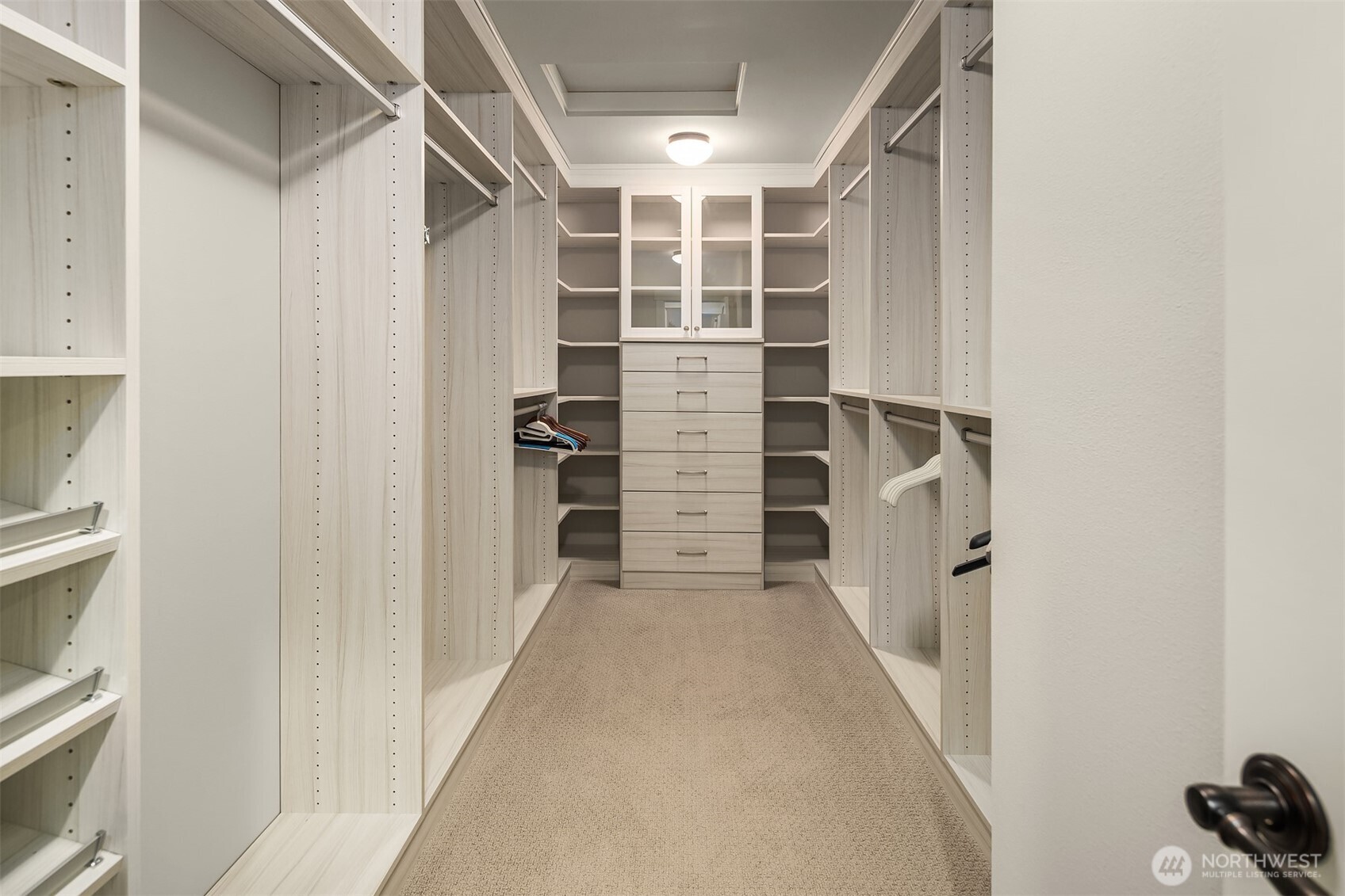 9934 Northeast 162nd Street Bothell, WA 98011 - Photo 30 of 40 a view of walk in closet with empty racks