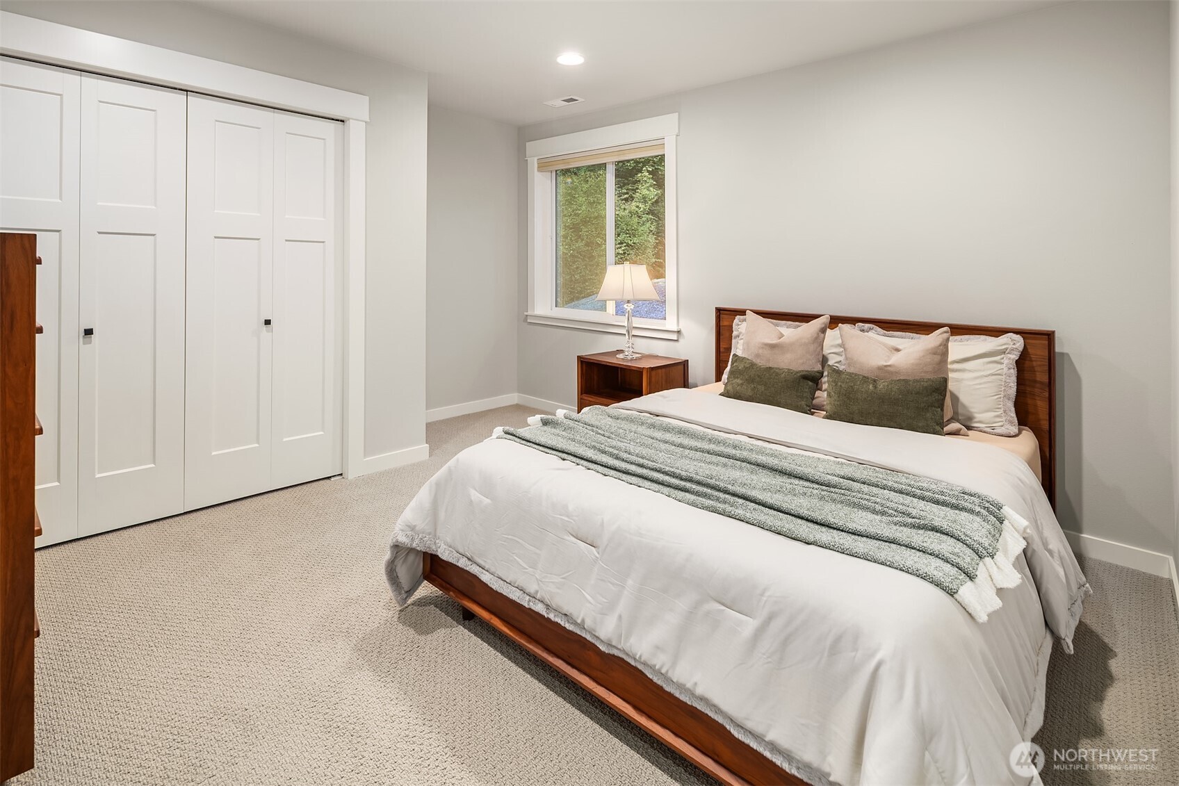 9934 Northeast 162nd Street Bothell, WA 98011 - Photo 32 of 40 a bedroom with a bed and window