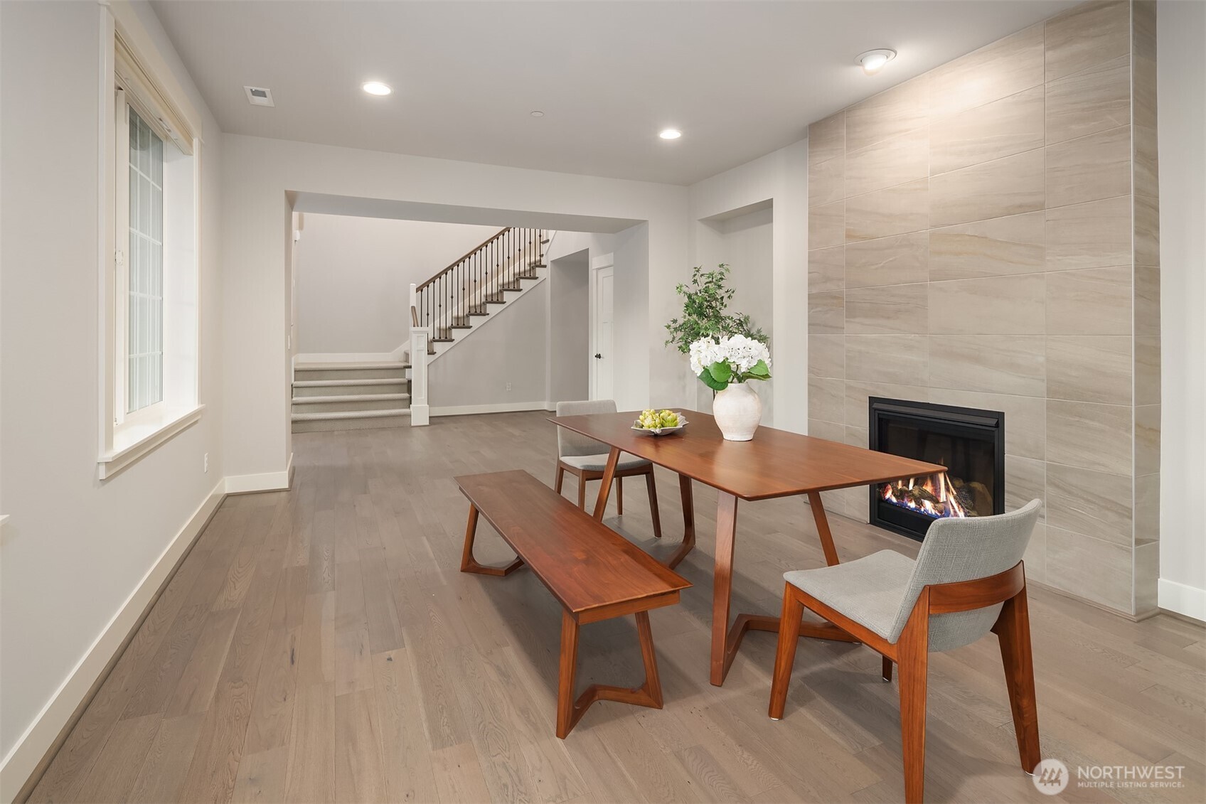 9934 Northeast 162nd Street Bothell, WA 98011 - Photo 7 of 40 a dining room with furniture and wooden floor
