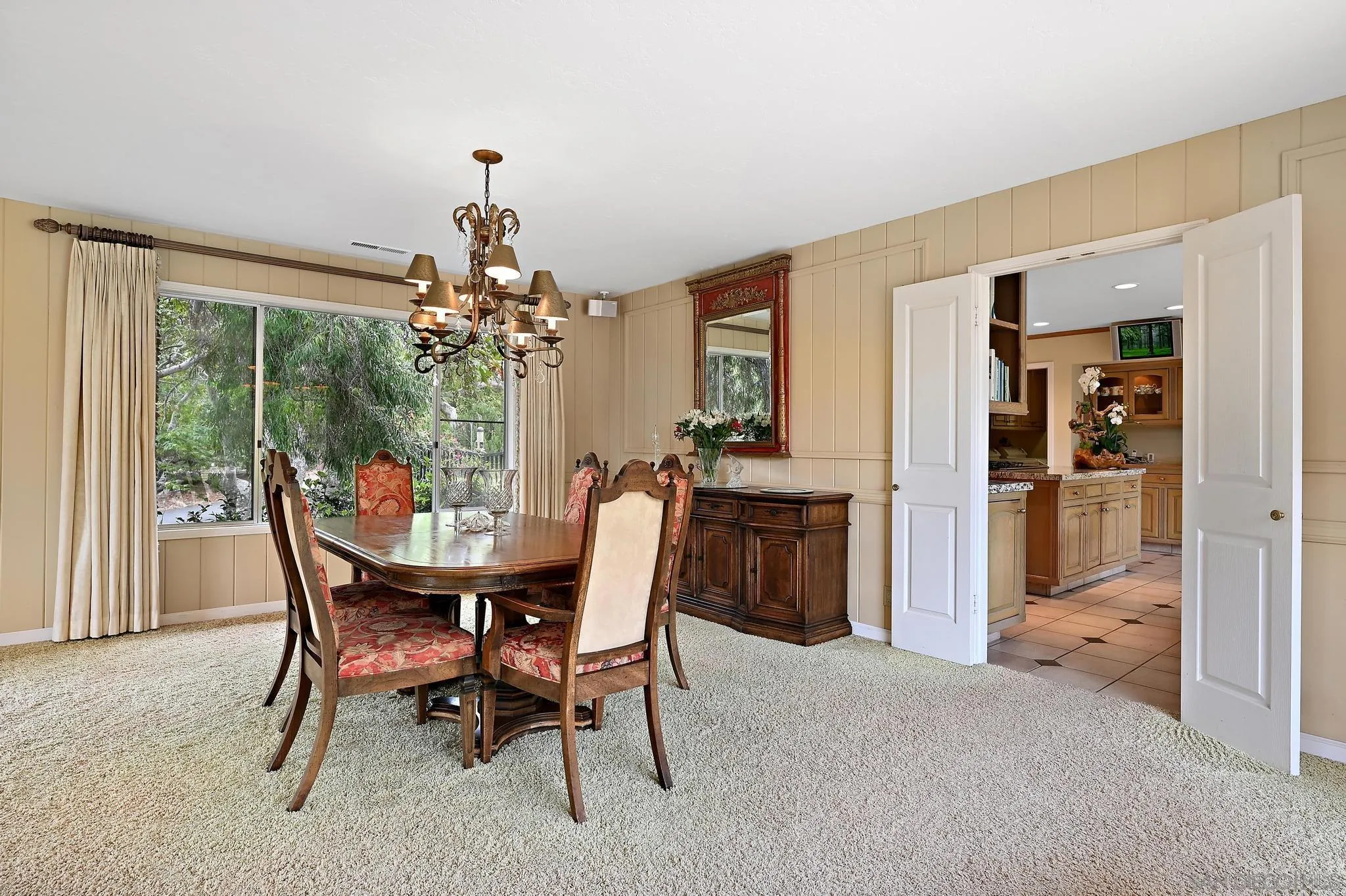 4200 Clearview Drive Carlsbad, CA 92008 - Photo 39 of 73 a dining room with furniture a chandelier and a rug