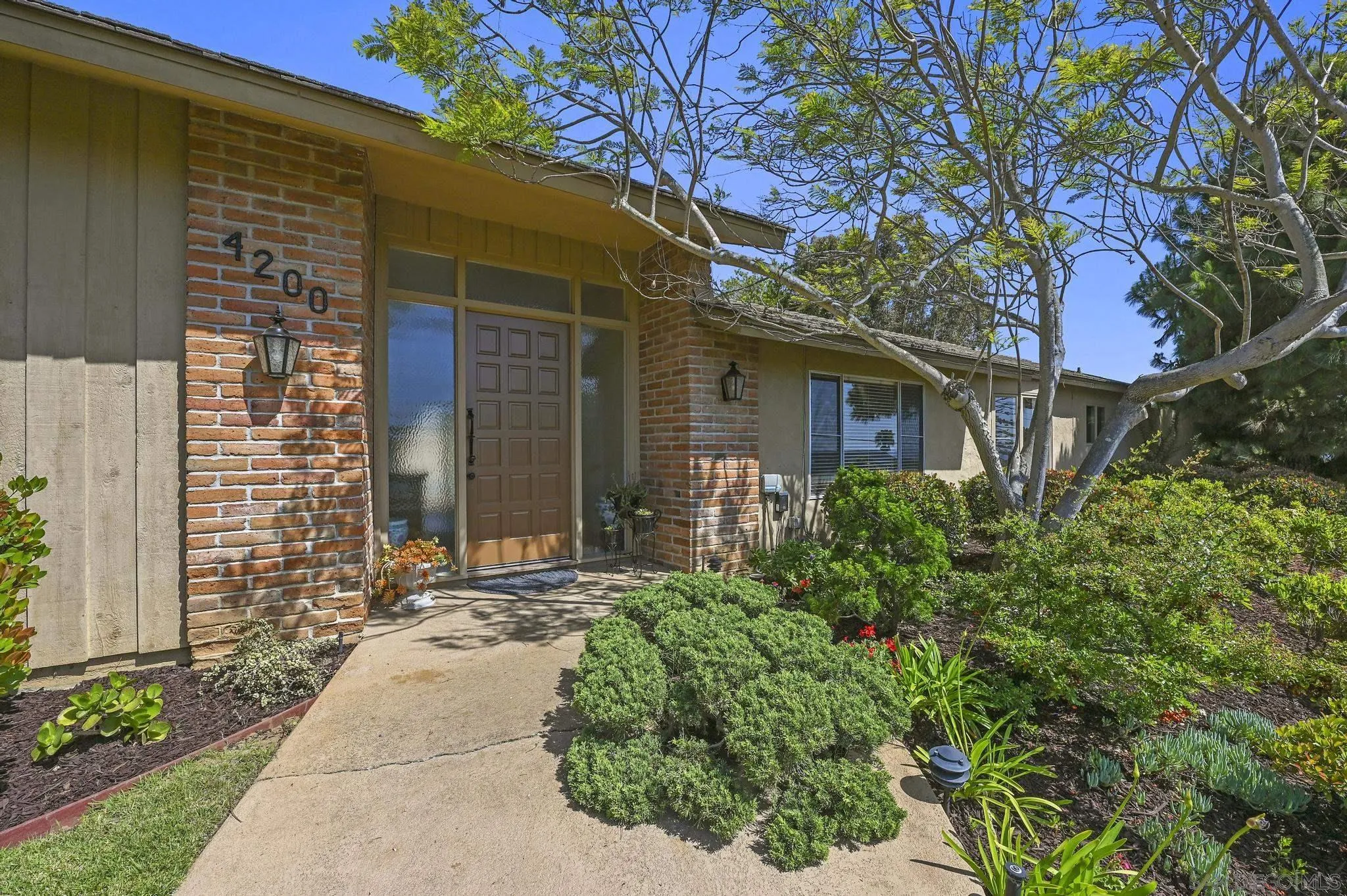 4200 Clearview Drive Carlsbad, CA 92008 - Photo 8 of 73 a front view of a house with a yard