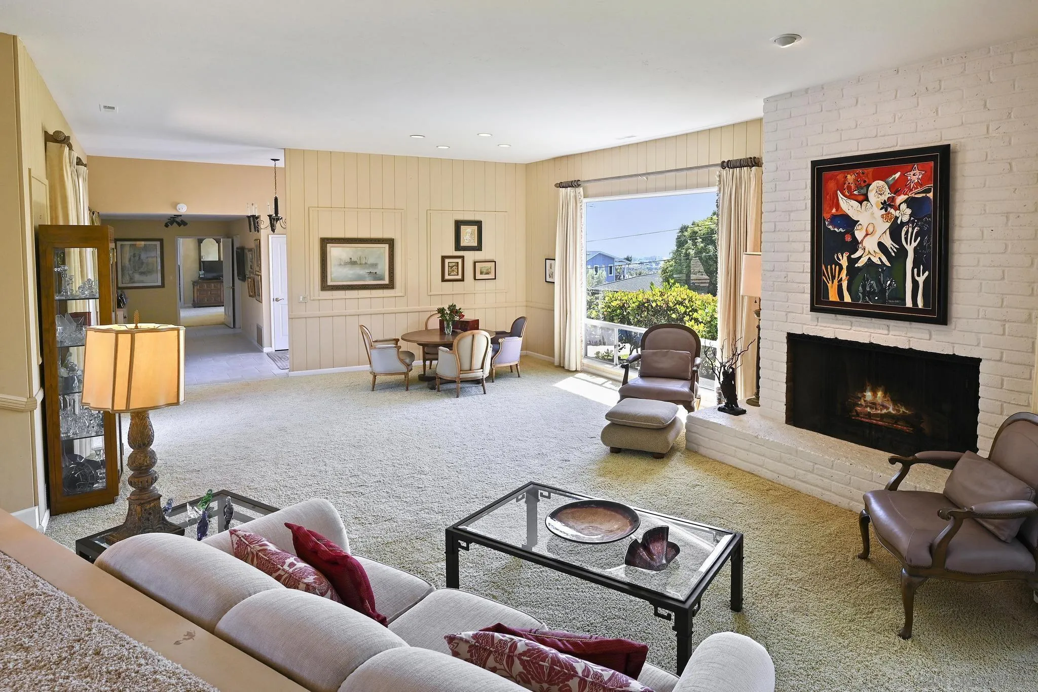 4200 Clearview Drive Carlsbad, CA 92008 - Photo 10 of 73 a living room with furniture fireplace and a large window