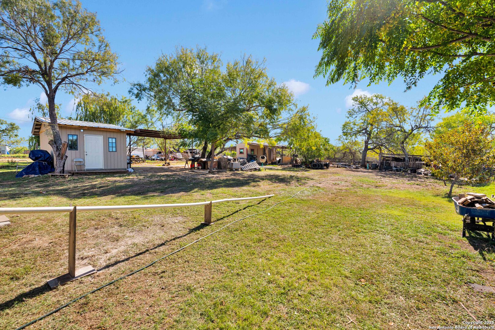 7176 Burshard Road San Antonio, TX 78263 - Photo 18 of 20 a view of an house with swimming pool and trees in the background