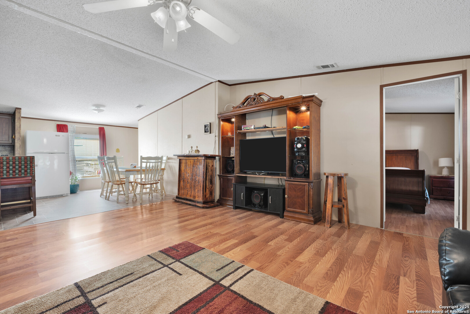 7176 Burshard Road San Antonio, TX 78263 - Photo 6 of 20 a living room with furniture and a flat screen tv