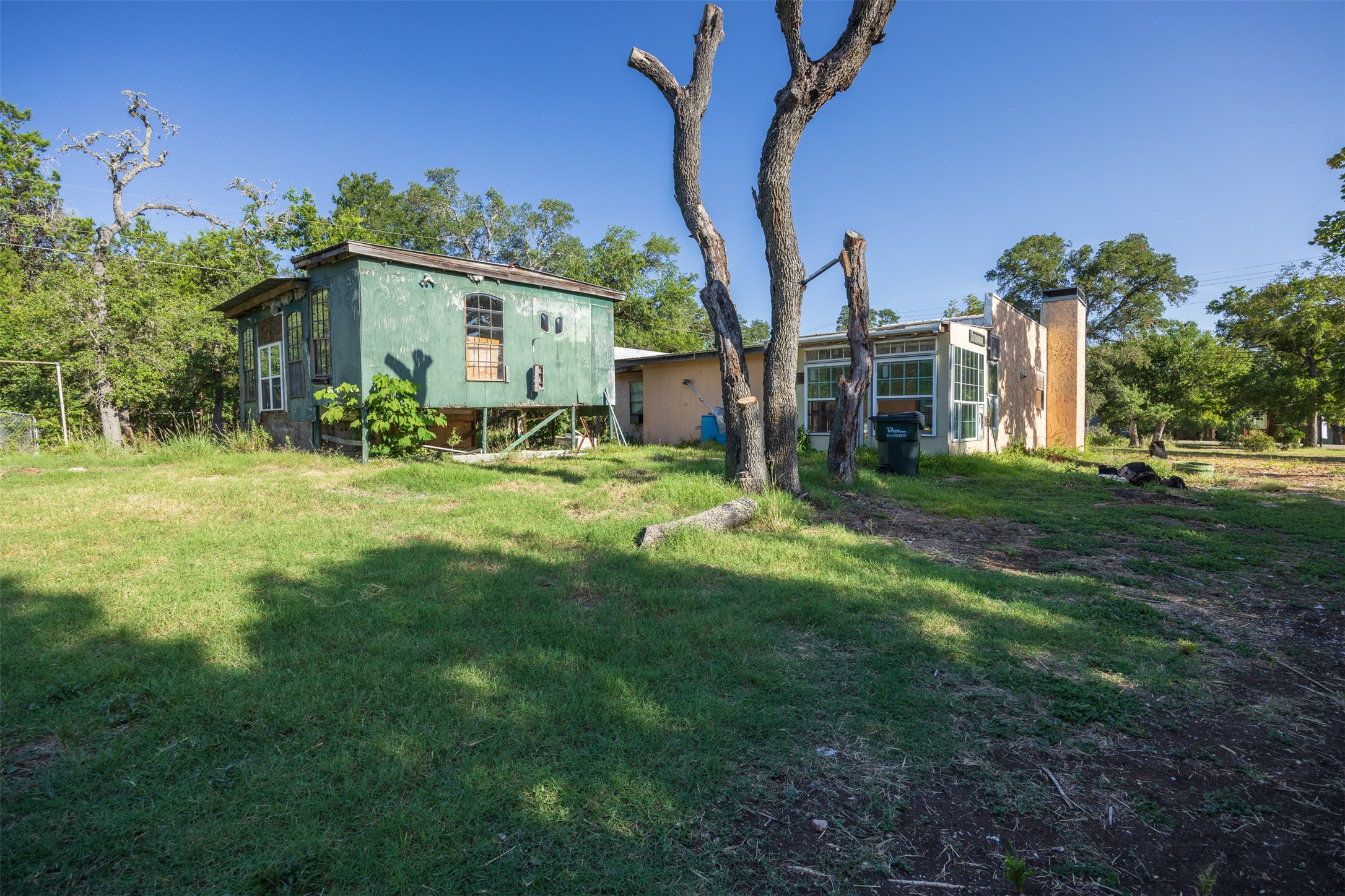 2105 Chaparral Park Road Manchaca, TX 78652 - Photo 16 of 18 a view of a house with a yard