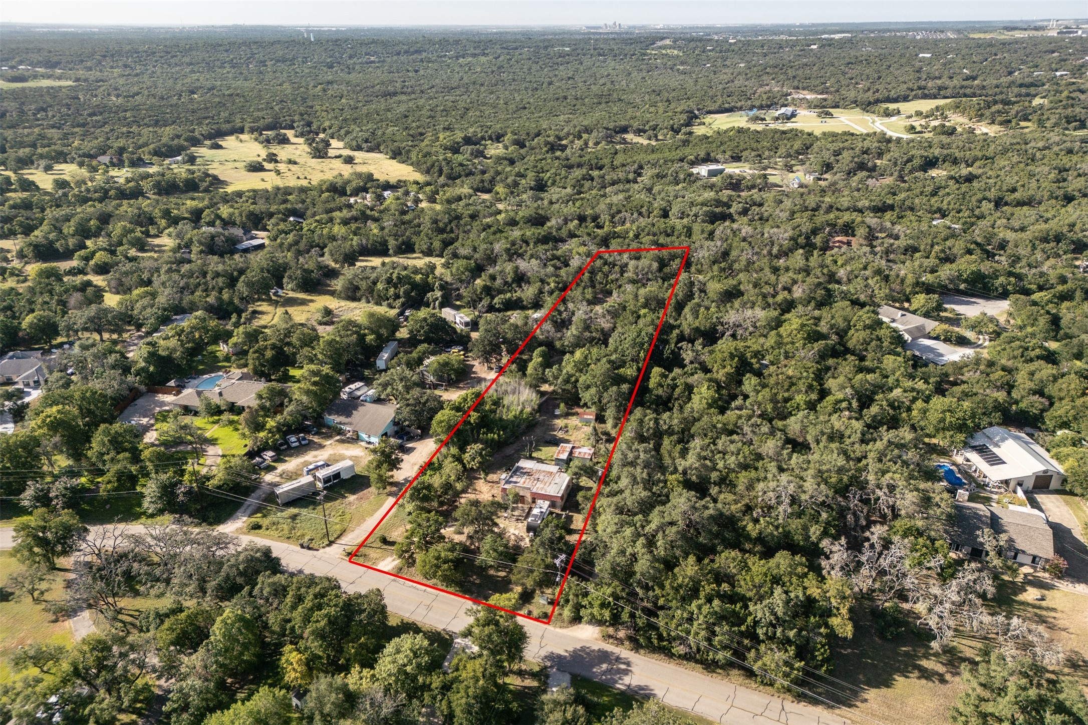 2105 Chaparral Park Road Manchaca, TX 78652 - Photo 3 of 18 an aerial view of residential houses with outdoor space