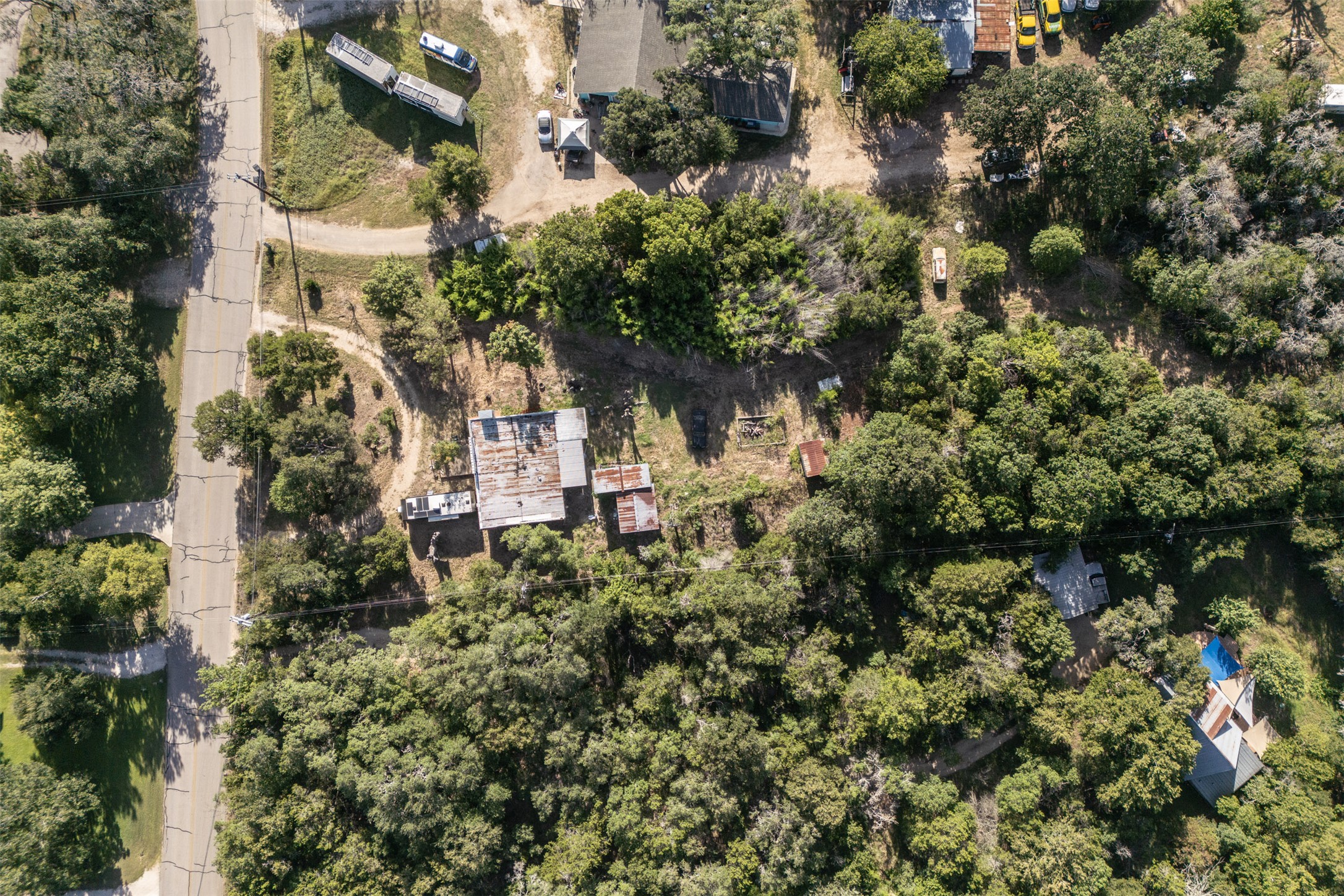 2105 Chaparral Park Road Manchaca, TX 78652 - Photo 7 of 18 an aerial view of a house with a yard and garden