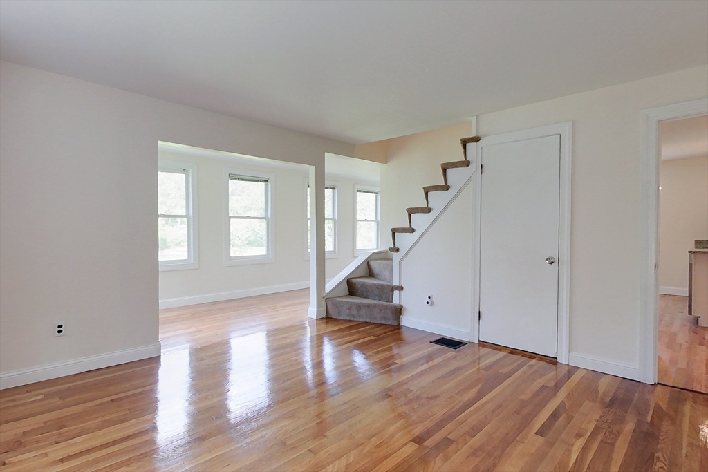 92 Squannacook Road Shirley, MA 01464 - Photo 11 of 38 a view of empty room with wooden floor and fan