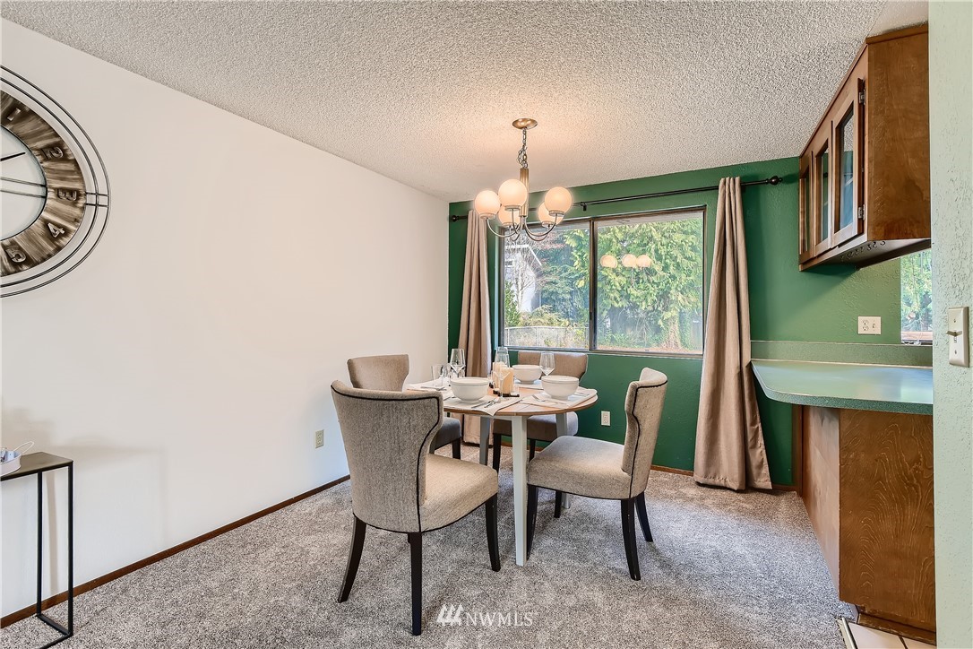 3 156th Place Southwest Bothell, WA 98012 - Photo 8 of 27 a view of a dining room with furniture window and outside view
