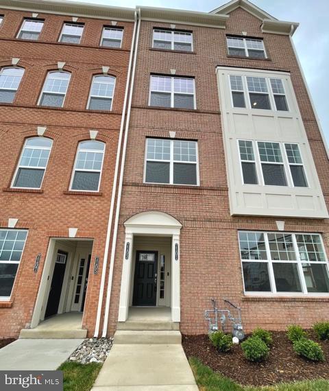 7103 Delegate Place Frederick, MD 21703 - Photo 1 of 42 a front view of a multi story residential apartment building