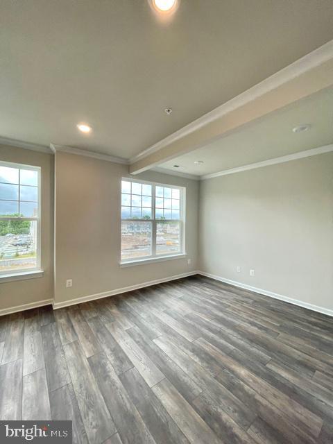 7103 Delegate Place Frederick, MD 21703 - Photo 15 of 42 an empty room with wooden floor and windows