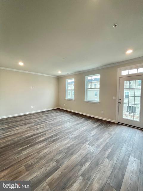 7103 Delegate Place Frederick, MD 21703 - Photo 20 of 42 an empty room with wooden floor and windows