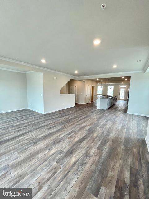 7103 Delegate Place Frederick, MD 21703 - Photo 21 of 42 an empty room with wooden floor and windows