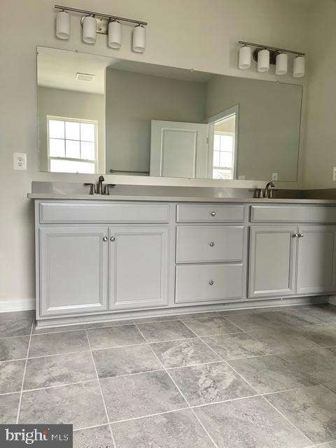 7103 Delegate Place Frederick, MD 21703 - Photo 30 of 42 a bathroom with a sink vanity and mirror