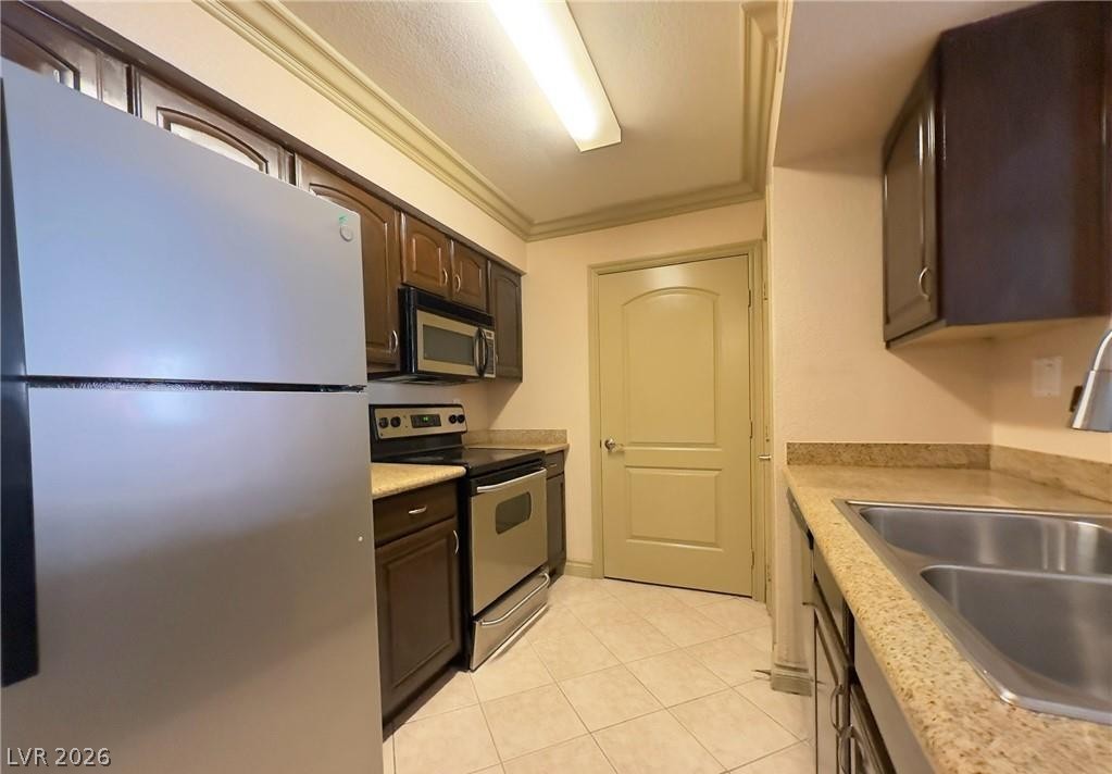 8101 West Flamingo Road, Unit 1082 Las Vegas, NV 89147 - Photo 10 of 23 Culinary convenience with stainless steel appliances and abundant cabinetry define this inviting kitchen.