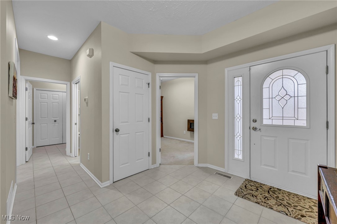 30257 Center Ridge Road Westlake, OH 44145 - Photo 19 of 42 Entrance foyer featuring baseboards and light tile patterned flooring
