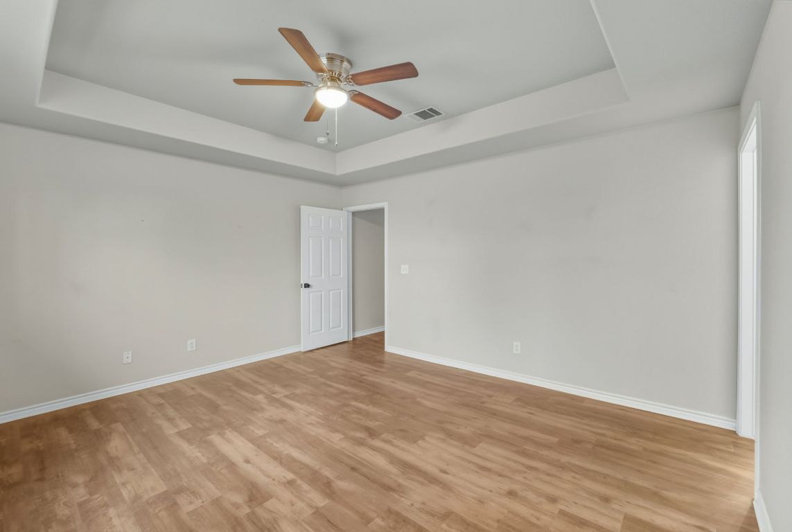 20808 Sandy Brown Lane Webberville, TX 78621 - Photo 11 of 40 wooden floor in an empty room
