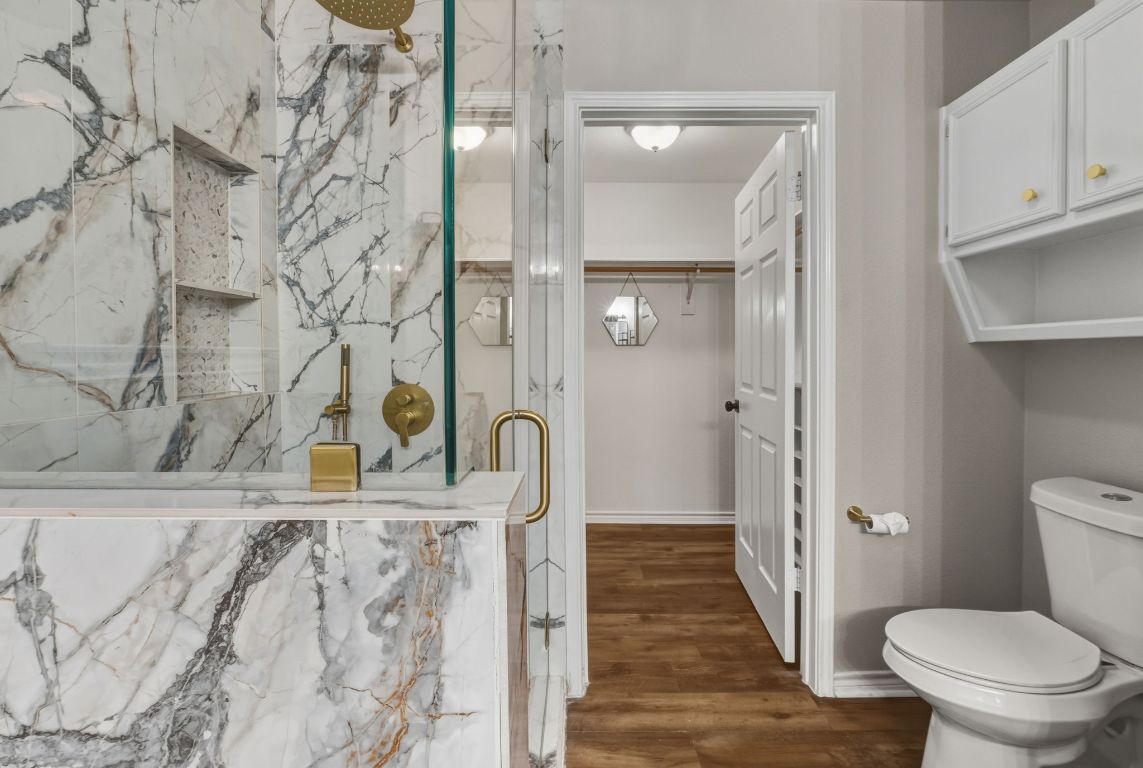 20808 Sandy Brown Lane Webberville, TX 78621 - Photo 15 of 40 a bathroom with a toilet and a shower