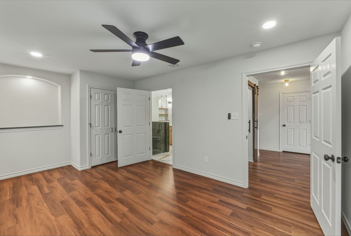 20808 Sandy Brown Lane Webberville, TX 78621 - Photo 21 of 40 a view of empty room with wooden floor