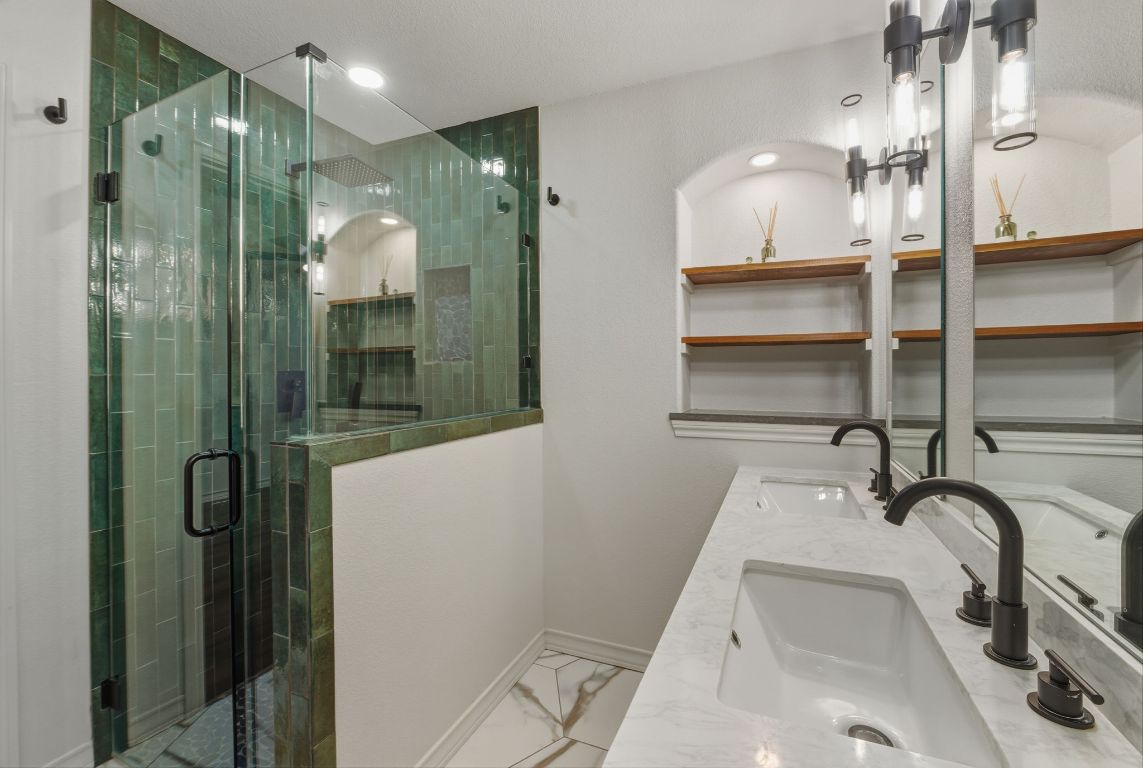 20808 Sandy Brown Lane Webberville, TX 78621 - Photo 23 of 40 a bathroom with a sink and mirror