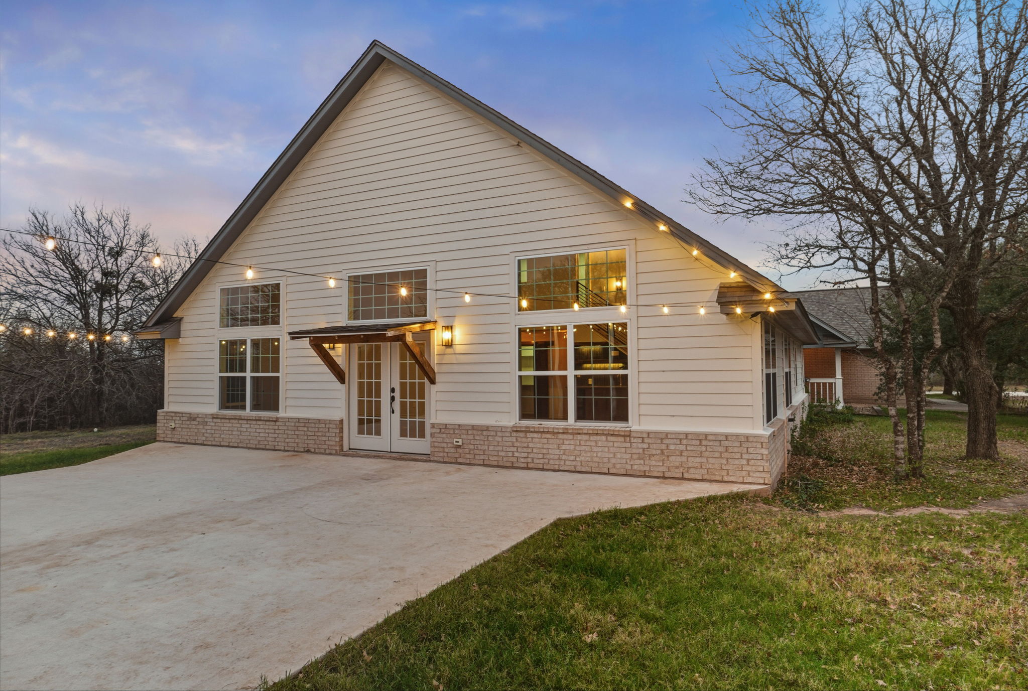 20808 Sandy Brown Lane Webberville, TX 78621 - Photo 4 of 40 a front view of house with yard and trees around
