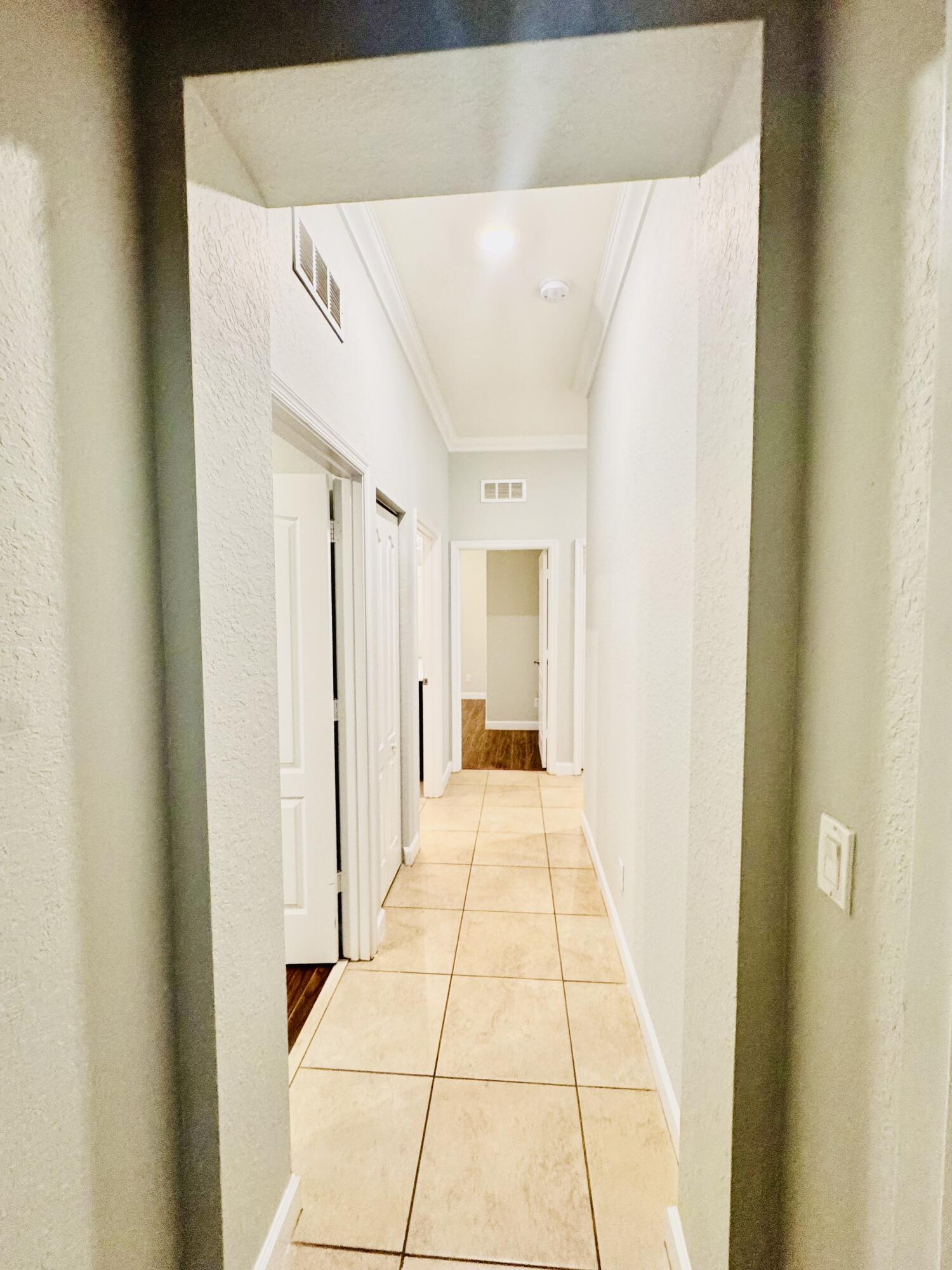 1807 Berkshire Circle Southwest Vero Beach, FL 32968 - Photo 12 of 22 a bathroom with a sink and a mirror