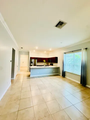 a kitchen with stainless steel appliances kitchen island granite countertop a sink and cabinets