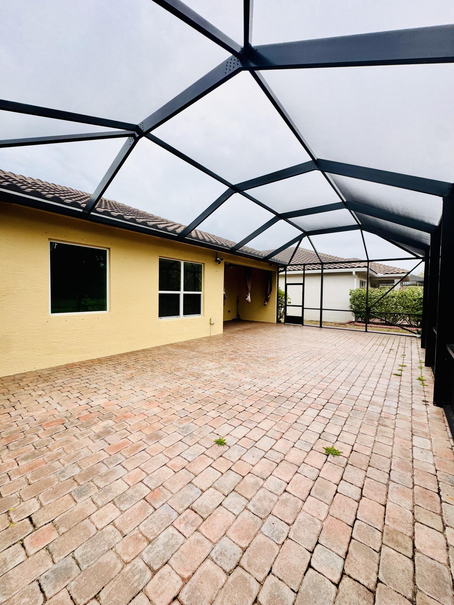 1807 Berkshire Circle Southwest Vero Beach, FL 32968 - Photo 21 of 22 a house view with a outdoor space