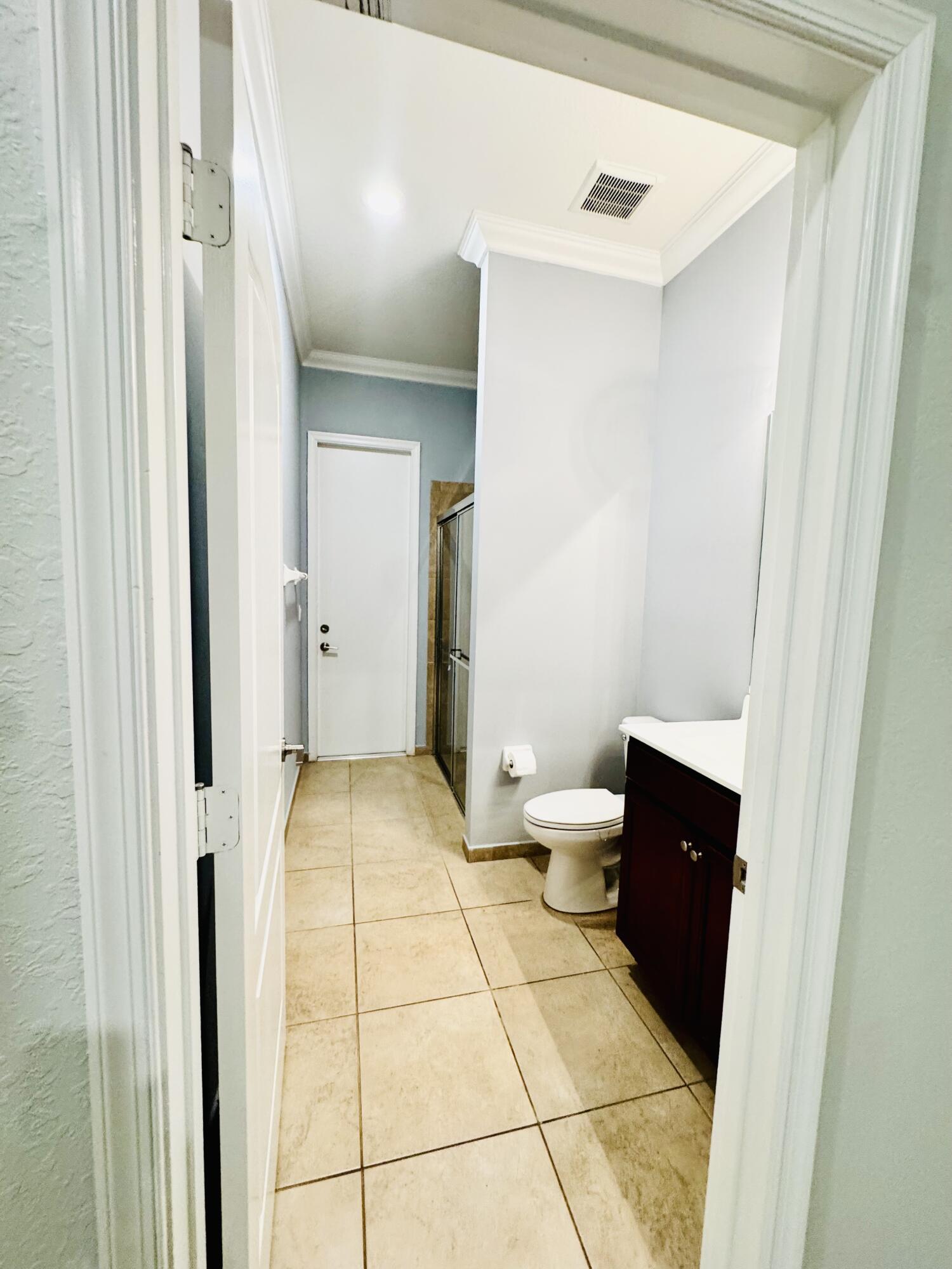 1807 Berkshire Circle Southwest Vero Beach, FL 32968 - Photo 10 of 22 a bathroom with a sink and a toilet