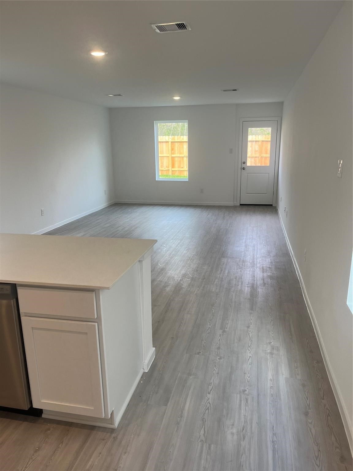 923 Pertuso Lane Huffman, TX 77336 - Photo 5 of 17 a view of empty room with window and wooden floor
