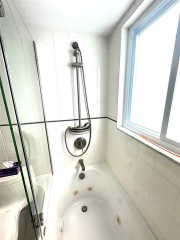 a bathroom with a sink and a window