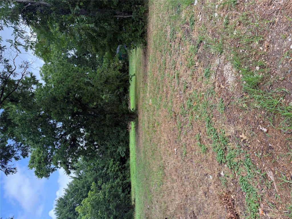 708 North Polk Avenue Cameron, TX 76520 - Photo 2 of 6 a view of a field with trees in background