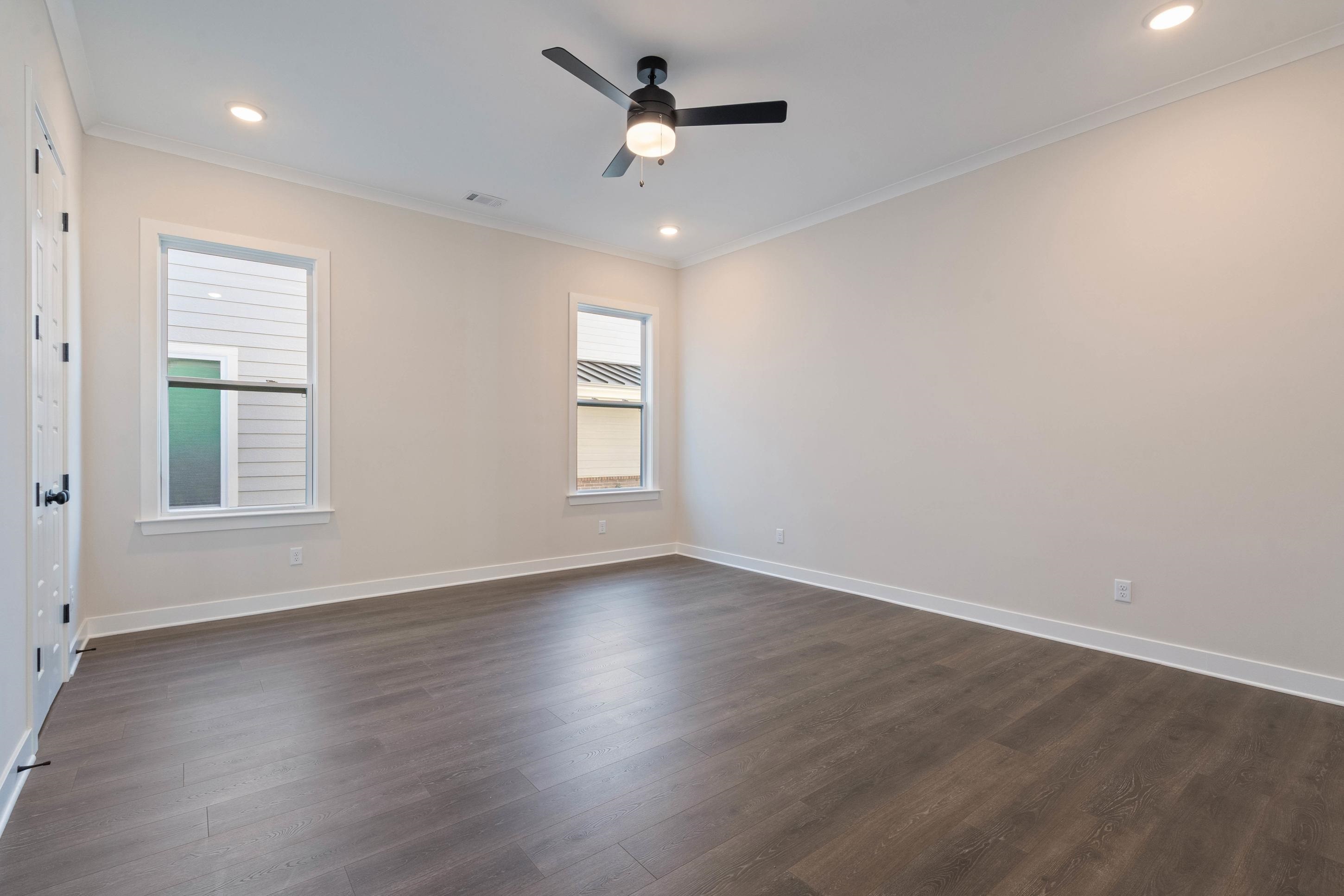 4844 Lyla Lane Collierville, TN 38017 - Photo 14 of 31 Unfurnished room featuring crown molding, dark wood finished floors, recessed lighting, and ceiling fan