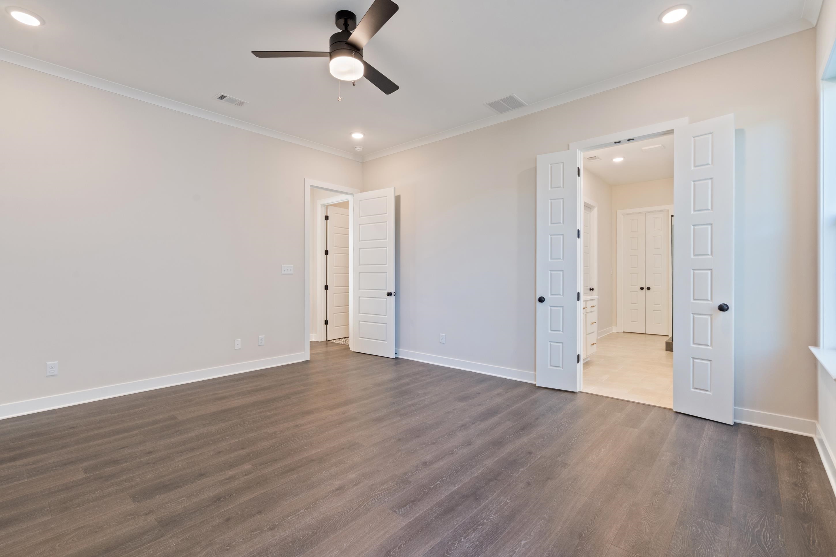 4844 Lyla Lane Collierville, TN 38017 - Photo 15 of 31 a view of an empty room with wooden floor